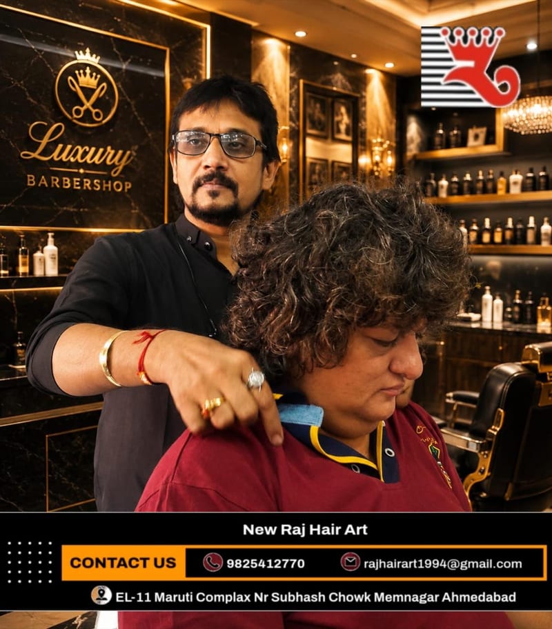 Barber cutting a customer's hair inside the barbershop