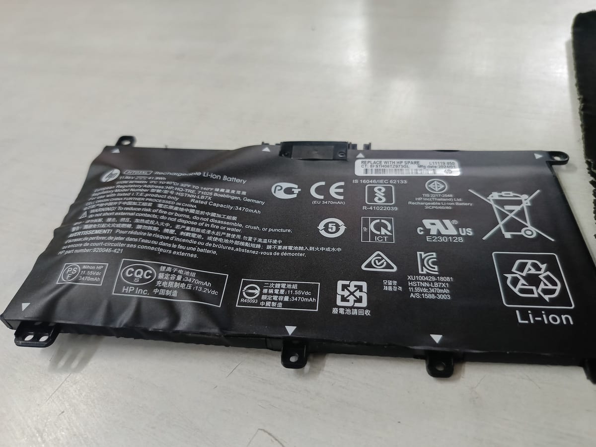 Black lithium-ion laptop battery with printed safety markings