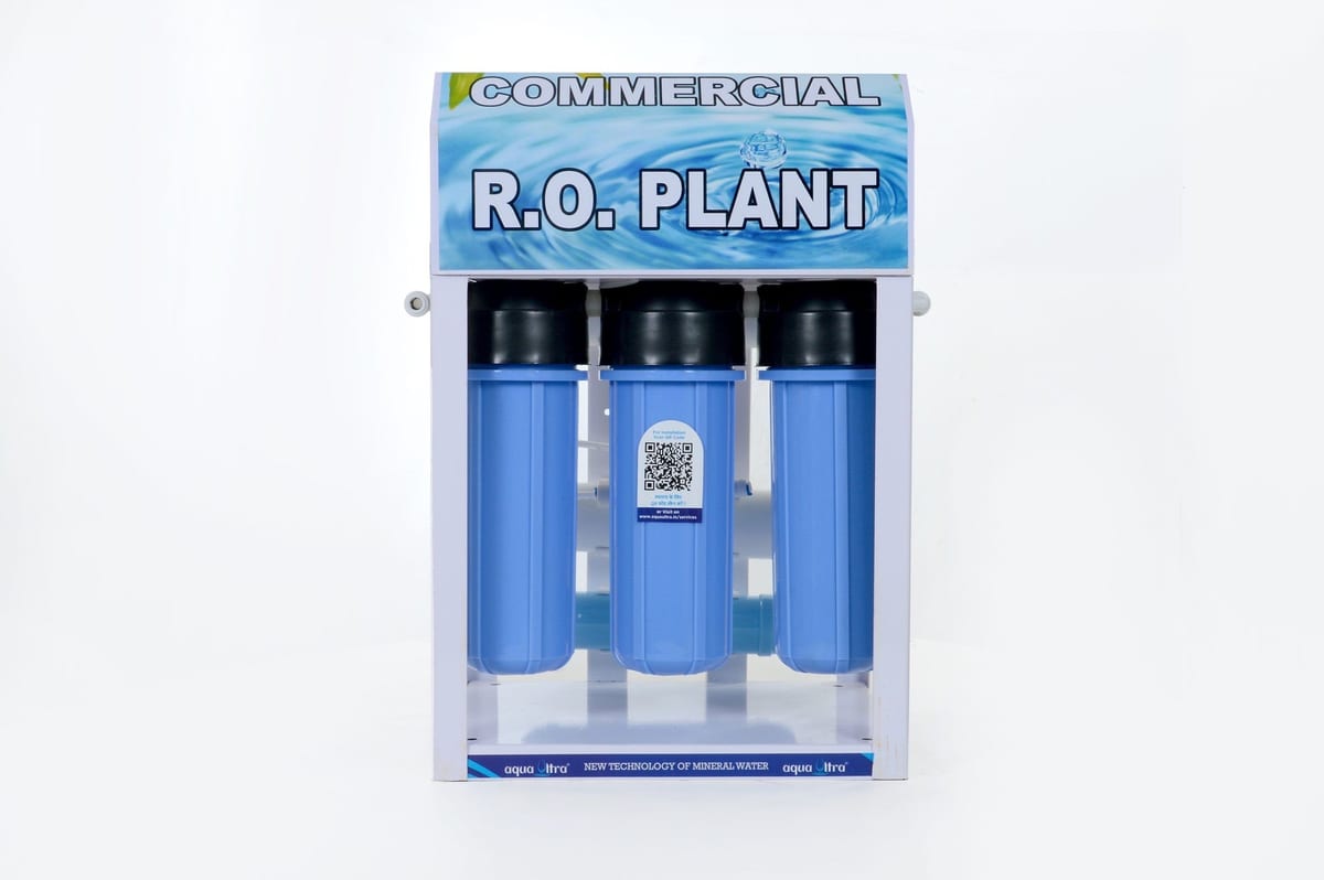 Commercial R.O. plant with three blue cylindrical filter housings