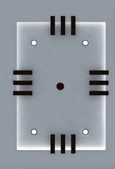 White geometric ceiling panel with black bars and circular detailing