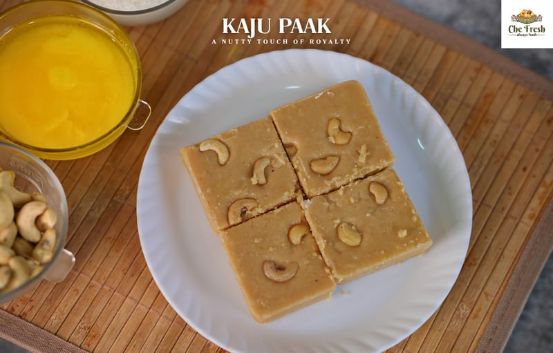 Square cashew sweets with bowls of yellow dessert and cashews