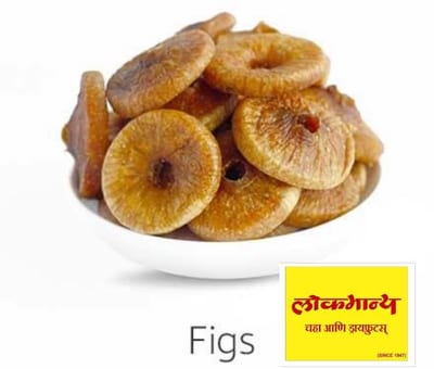 Dried figs on a white plate with a yellow Figs label