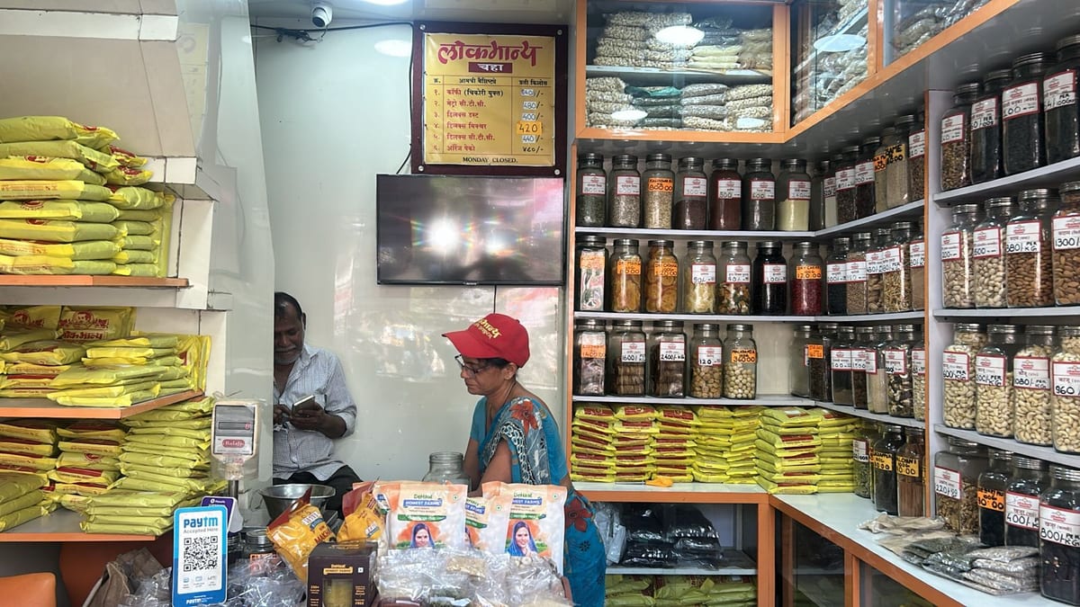 Lokmanya shop interior with shelves of packaged grains, spices and jars