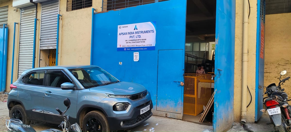 APSAN India Instruments blue building exterior with vehicles parked outside