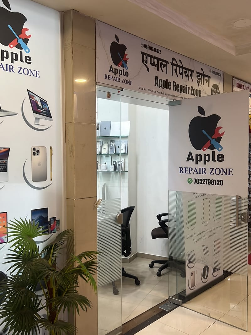 Apple Repair Zone shopfront with glass entrance, chairs and product displays