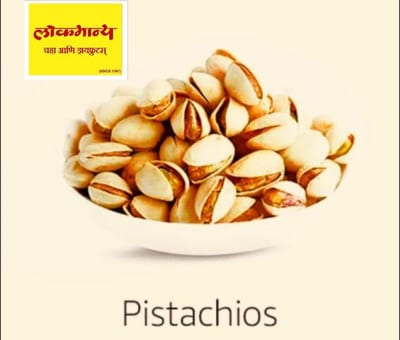 Bowl of pistachios with Devanagari text and a Pistachios label
