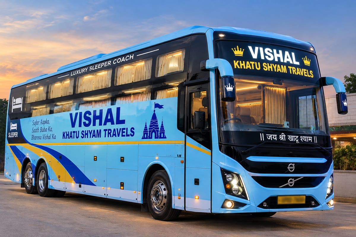 Blue double-decker sleeper coach labelled Vishal Khatu Shyam Travels under a cloudy sky