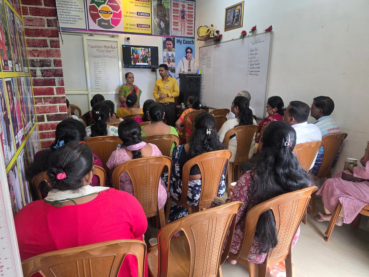 Classroom gathering with seated attendees and two presenters at the front