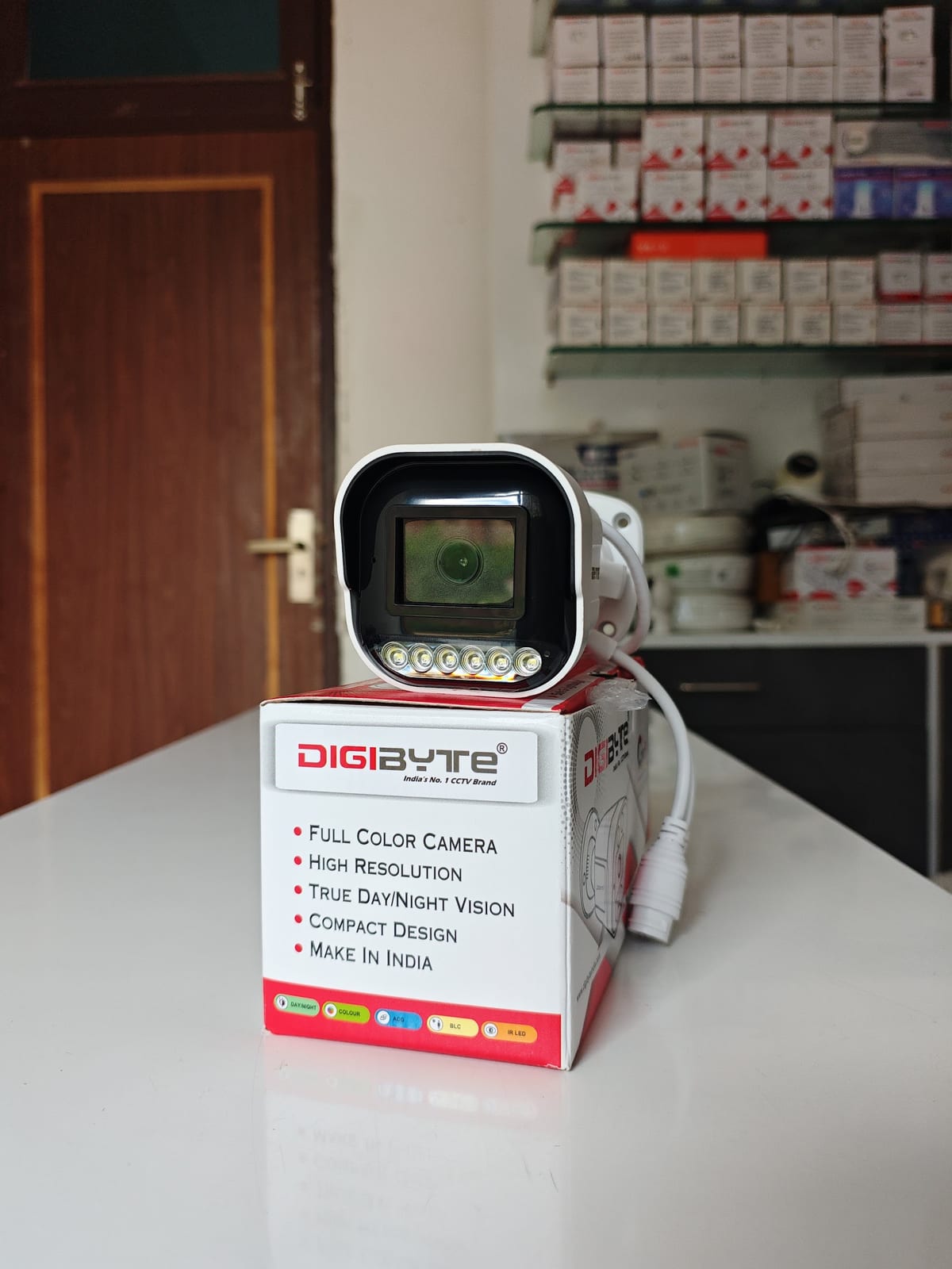 DigiByte camera displayed on its retail box with shelves behind
