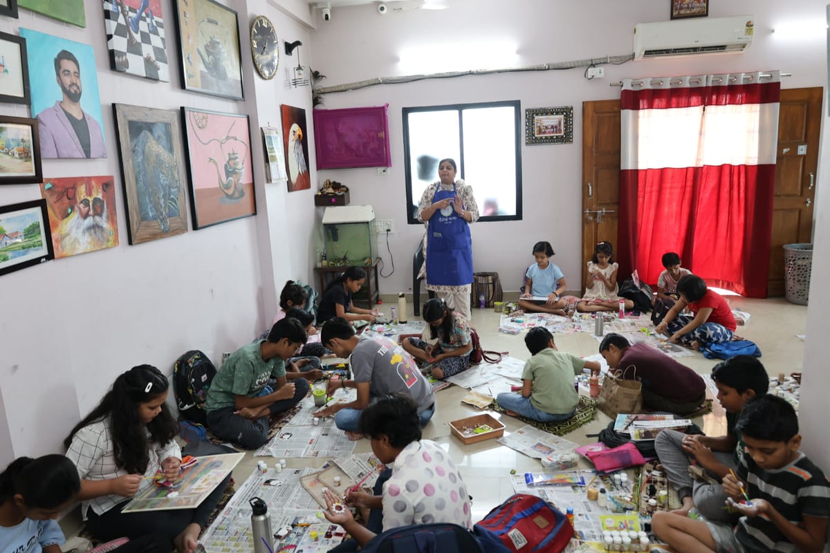 Adults and children making crafts at tables while an adult stands near a window